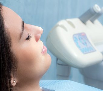 Woman relaxing with eyes closed while visiting sedation dentist in Waverly