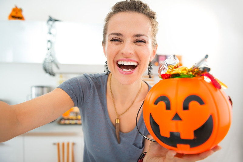 Patient smiling with good dental health and Halloween candy